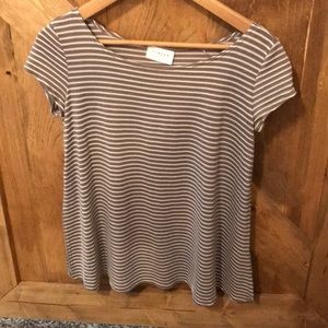 Light brown and white stripped shirt.